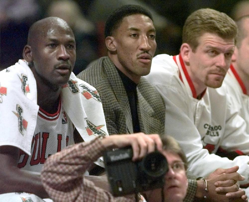 Chicago Bulls guard Michael Jordan (45) and forward Scottie Pippen (33)  walk back to the bench