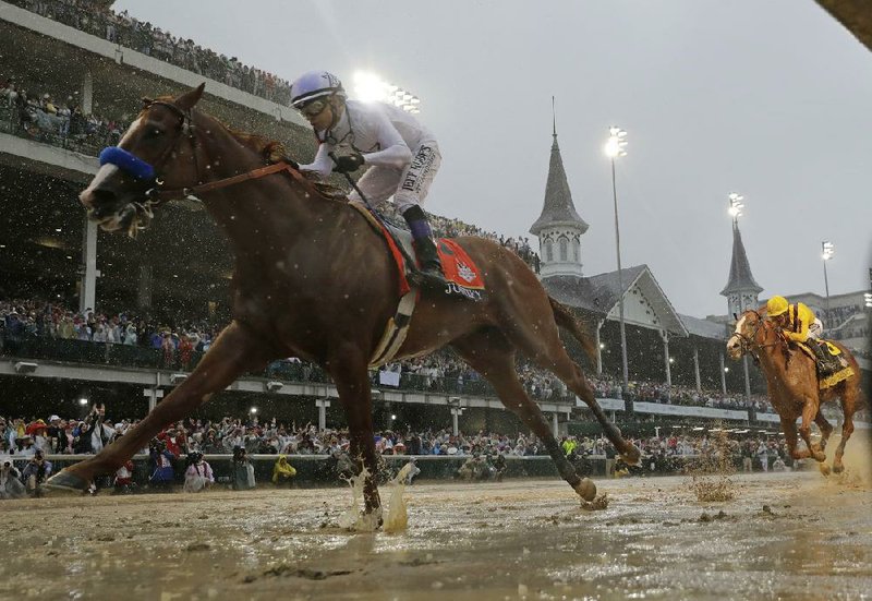 Mike Smith rides Justify to victory during the Kentucky derby in 2018 at Churchill downs in Louisville, Ky. The move of the Triple Crown’s rst leg to labor day weekend because of the coronavirus pandemic will mark the first time the derby won’t run on the rst Saturday in May since 1945. (ap file photo) 