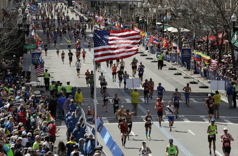 Runners head down the stretch to the finish line in the 121st Boston Marathon in Boston in this April 17, 2017, file photo. The 124th running of the Boston Marathon, which had been postponed from its traditional third Monday in April until Sept. 14, 2020, has now been canceled for 2020 entirely.