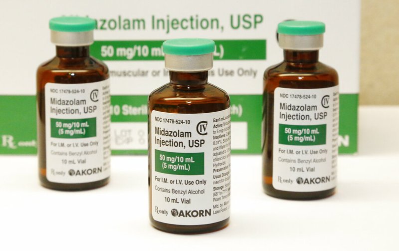 FILE - This July 25, 2014 file photo shows bottles of the sedative midazolam at a hospital pharmacy in Oklahoma City. story.lead_photo.caption