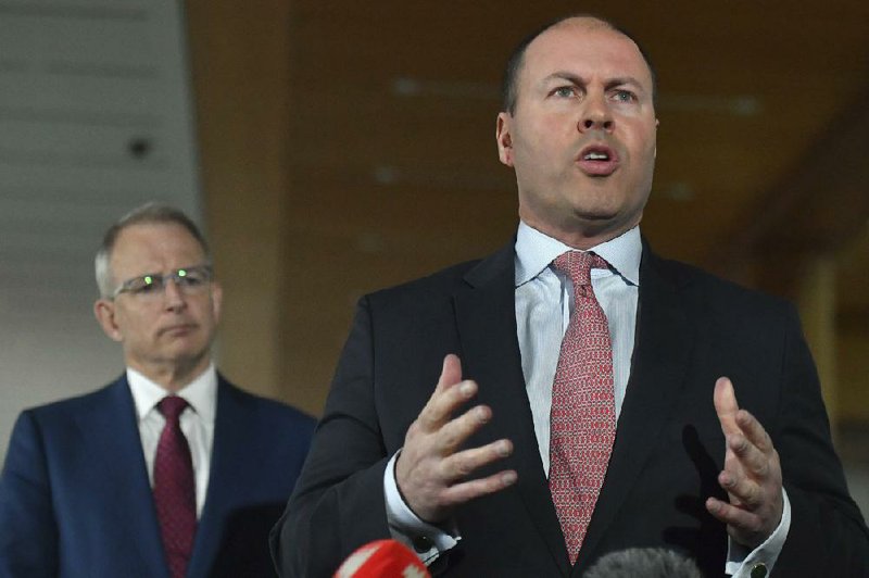 Australian Treasurer Josh Frydenberg, shown during Monday’s announcement with Communications Minister Paul Fletcher, said the government was “very conscious of the challenges” of forcing companies to pay for news content, after previous efforts in France and Spain had failed.
(AP/AAP Image/Mick Tsikas)