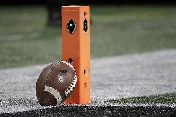 A football rests on a pylon before the NCAA college football playoff championship game between Georgia and Alabama, Monday, Jan. 8, 2018, in Atlanta. (AP Photo/David J. Phillip)

