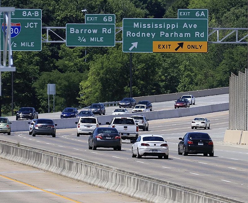 Cars travel along recently widened stretch of Interstate 630 Tuesday April 21, 2020, in Little Rock. The Arkansas Department of Transportation has lane closures planned between 8:00 p.m. and 6:00 a.m. through Thursday night on the portion of I-630 between Baptist Health Drive and University Avenue for the placement of permanent pavement markings. (Arkansas Democrat-Gazette/Staton Breidenthal)