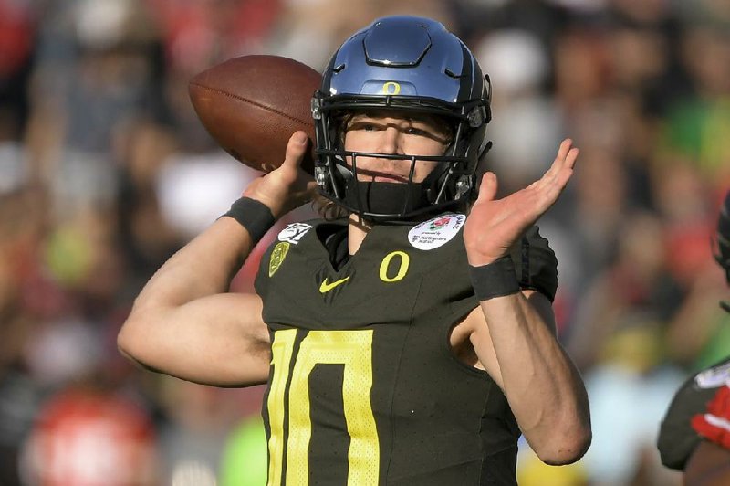 Justin Herbert was a successful quarterback at Oregon, but his suc- cess in the NFL could largely depend on an immeasurable quality. (AP file photo) 
