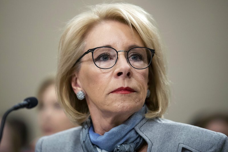 FILE - In this Feb. 27, 2020, file photo, Education Secretary Betsy DeVos pauses as she testifies during a hearing of a House Appropriations Sub-Committee on the fiscal year 2021 budget on Capitol Hill in Washington.