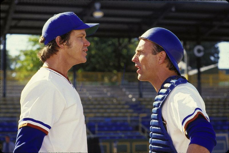 Tim Robbins (left) stars as Ebby Calvin “Nuke” LaLoosh and Kevin Costner plays Crash Davis in the baseball film Bull Durham. Hoosiers shot all the way to No. 1 in The Associated Press Top 25 of best sports movies, narrowly edging Rocky — released in 1976, and Bull Durham — starring Costner, Robbins and Susan Sarandon in 1988.