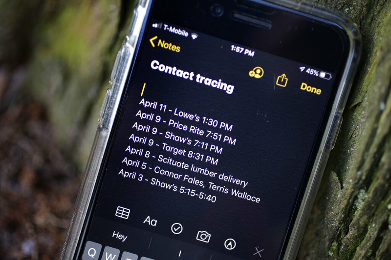 A smartphone belonging to Drew Grande of Cranston, R.I., shows notes he made for contact tracing in this April 15, 2020, file photo. Grande began keeping a log on his phone at the beginning of April, after he heard Rhode Island Gov. Gina Raimondo urge residents to begin out of concern about the spread of the coronavirus.
