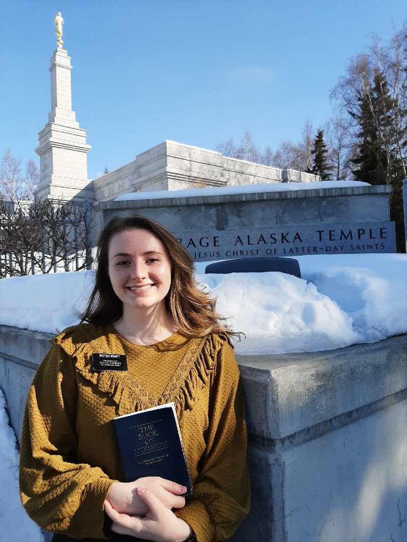 Kira Kraft of Little Rock stands in front of a Church of Jesus Christ of Latter-day Saints temple in Anchorage, Alaska, where she served one of the two months she spent on her mission. “It’s like an ice palace,” she said of the temple. Kraft is one of 35,000 missionaries out of 67,000 worldwide who have been sent to their home countries and states as the covid-19 pandemic continues its spread.
(Special to the Democrat-Gazette)