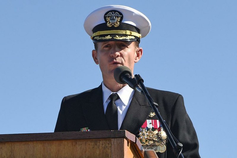 Capt. Brett Crozier addresses the crew on the flight deck of the aircraft carrier Theodore Roosevelt in November during a changeof- command ceremony in San Diego.
(The New York Times/U.S. Navy)