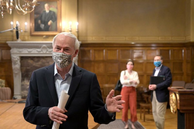 Gov. Asa Hutchinson answers a reporter’s question Saturday at the end of a daily news conference in Little Rock on Arkansas’ response to the coronavirus pandemic. More photos at arkansasonline.com/426gov/.
(Arkansas Democrat-Gazette/Stephen Swofford)