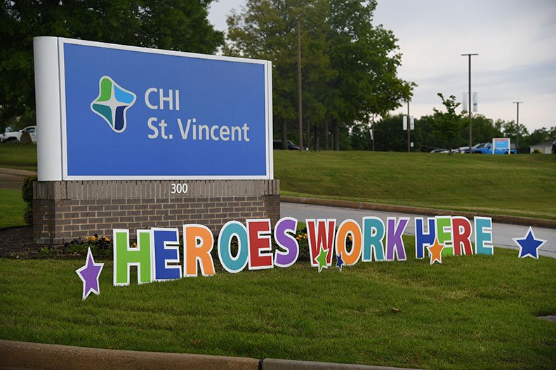 A "Heroes Work Here" sign is located on the grounds of CHI St Vincent Hot Springs along Werner Street. - Photo by Grace Brown of The Sentinel-Record
