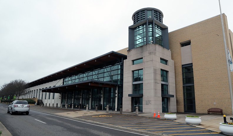 A motorist passes the Hot Springs Convention Center on March 17, 2020.