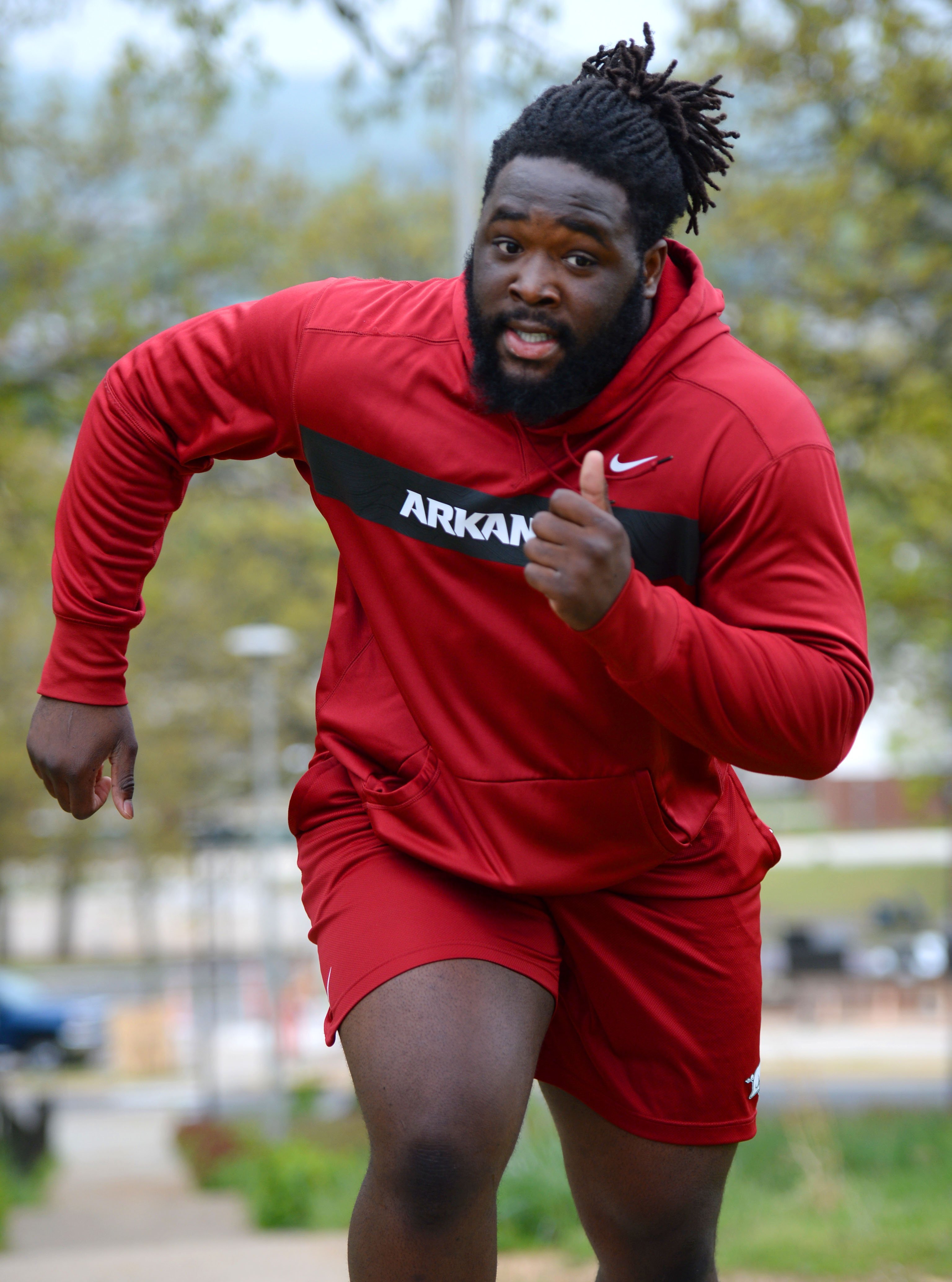 Denver Broncos defensive lineman McTelvin Agim, left, linebacker