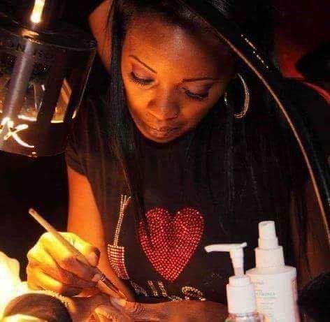 Rosalyn Brown of Nailtorious Nails works on a client’s fingernails. Brown emphasizes cuticle mois- turization for those doing their own nails and warns against over-clipping the cuticles. (Special to the Democrat-Gazette) 