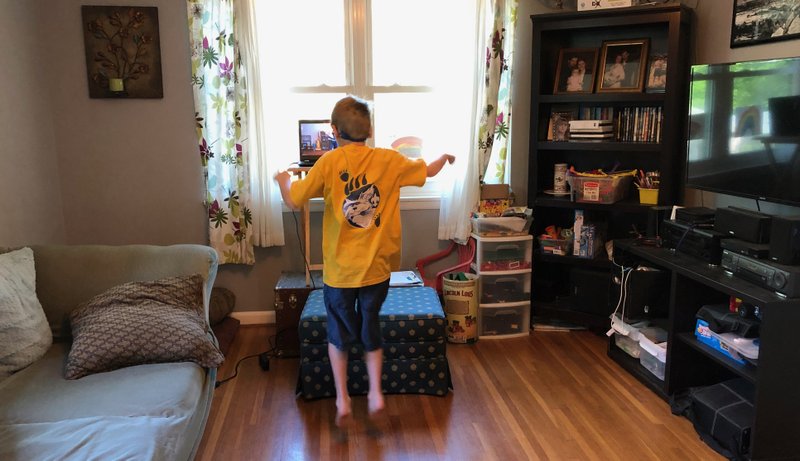 Kevin Mainard O'Connell, 9, keeps up his training with Unity Martial Arts by taking an online self-defense class April 21 with sensei Gaylan Lewallen. (Arkansas Democrat-Gazette/Celia Storey) 