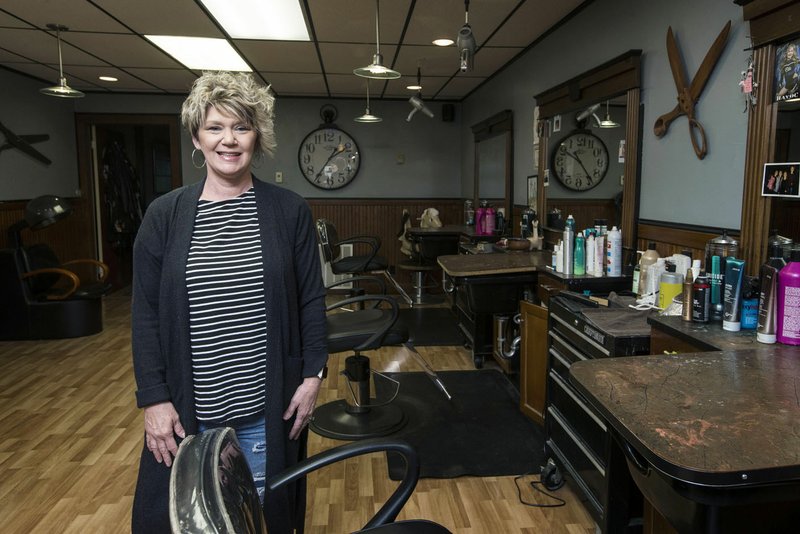 Tracey Dillard, owner of Hairbenders, poses for a photo Wednesday, April 22, 2020, at the hair and tanning business in downtown Gentry. Go to nwaonline.com/photos to see more photos.
(NWA Democrat-Gazette/Ben Goff)