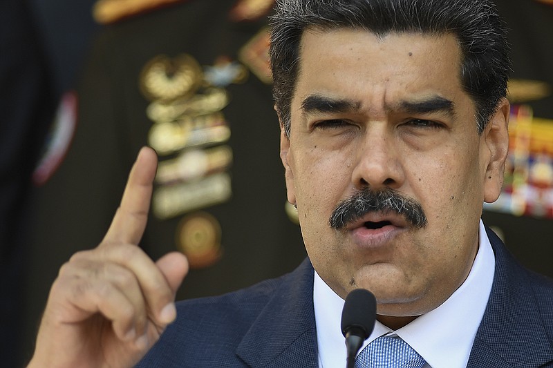 FILE - In this March 12, 2020, file photo, Venezuelan President Nicolas Maduro speaks at a press conference at the Miraflores Presidential Palace in Caracas, Venezuela. (AP Photo/Matias Delacroix, File)
