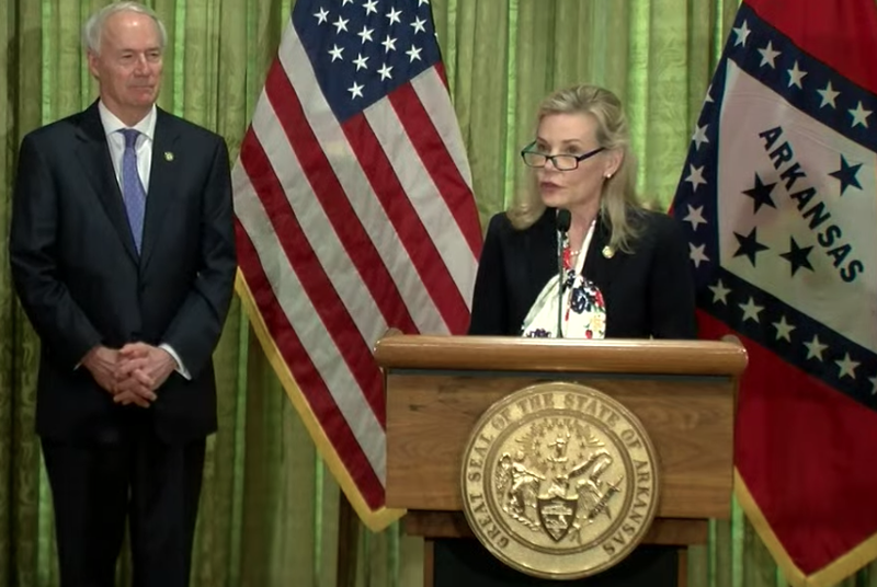 Stacy Hurst, secretary of the Arkansas Department of Parks, Heritage and Tourism, speaks to reporters in Little Rock on Tuesday in this screen grab of video provided by the governor's office. 