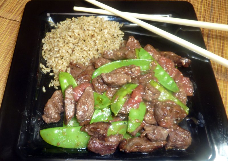 Stir-fried beef, along with crisp rice, takes on a unique twist with grapefruit on board.

(TNS/Linda Gassenheimer)