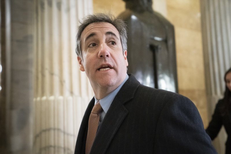 FILE - In this March 6, 2019, file photo, Michael Cohen, President Donald Trump's former lawyer, returns to Capitol Hill for testimony in Washington. The federal Bureau of Prisons has begun releasing hundreds of inmates to home confinement in an effort to slow the spread of the coronavirus behind bars. But their methods are murky and contradictory, despite criteria from the attorney general on who is eligible. Advocates worry there&#x2019;s a disparity. Wealthier inmates with access to high-priced lawyers, like convicted felons Cohen and Michael Avenatti, are walking out the door, while the poor remain behind bars (AP Photo/J. Scott Applewhite, File)