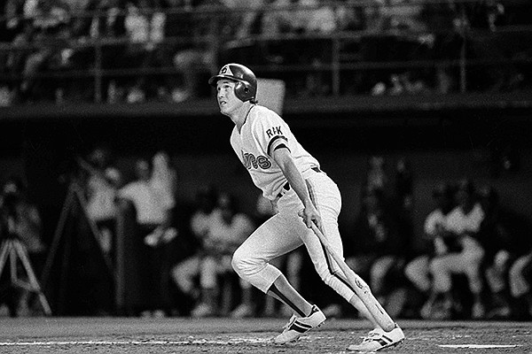 San Diego Padres Kevin McReynolds watches his fifth inning three-run homer sail over the wall as he heads for first base in Game 3 of the National League playoffs in San Diego, Oct. 5, 1984. The homer helped the Padres to a 7-1 victory over the Chicago Cubs. (AP Photo)