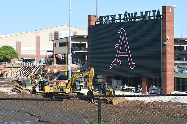 Construction crews work at the future site of the J.B. Hunt Family Baseball Performance Center on Wednesday, April 29, 2020, in Fayetteville.