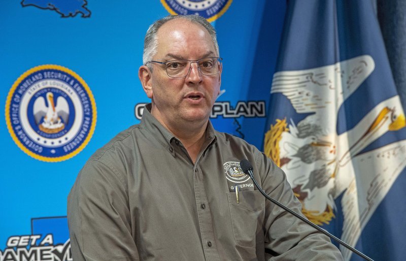 Gov. John Bel Edwards addresses steps being taken to fight the coronavirus and the status of cases in the state during a press conference at the GOHSEP Thursday April 23, 2020, in Baton Rouge, La. (Bill Feig/The Advocate via AP, Pool)