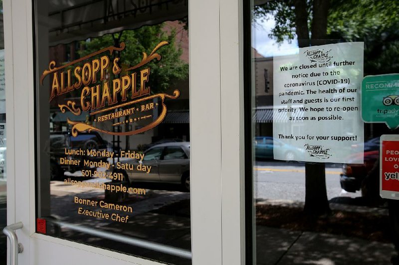 A sign on the door Wednesday at Allsopp and Chapple in downtown Little Rock notes that the restaurant is closed until further notice.
(Arkansas Democrat-Gazette/Thomas Metthe)