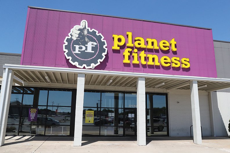 The front of Planet Fitness.Planet Fitness, 3310 Central Ave., sits dark and locked due to COVID-19 pandemic restrictions on Thursday. Gyms will be allowed to reopen Monday. - Photo by Richard Rasmussen of The Sentinel-Record