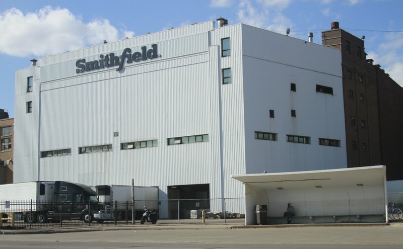 This April 8, 2020 file photo, shows the Smithfield pork processing plant in Sioux Falls, S.D. The union representing employees at the South Dakota pork processing plant says it will partially reopen on Monday, May 4, 2020, after shuttering more than two weeks ago because of a coronavirus outbreak that infected hundreds of employees. (AP Photo/Stephen Groves File)