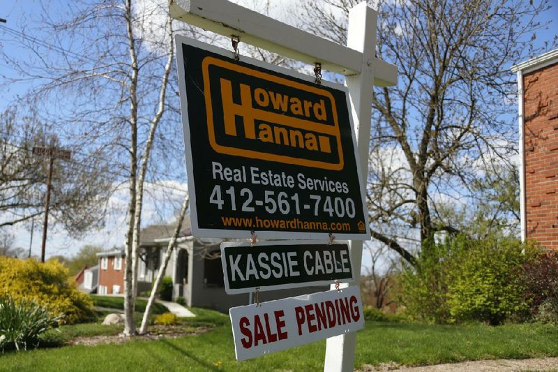 A sale pending sign stands outside a home in Mount Lebanon, Pa., in this April 27, 2020, file photo. Long-term mortgage rates tumbled to all-time lows in the last week of April as the economy and housing market continued to reel from the business and social shutdown.
(AP/Gene J. Puskar)
