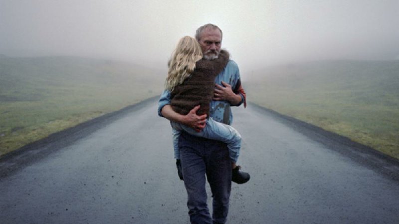 Grieving police detective (Ingvar Sigurdsson) comforts his granddaughter Salka (Ída Mekkín Hlynsdóttir, the real-life daughter of director Hlynur Pálmason) in the Icelandic thriller A White, White Day, now available for streaming.