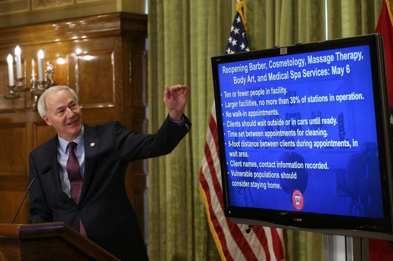 Gov. Asa Hutchinson outlines the reopening of barber shops, salons and tattoo parlors during the daily covid-19 briefing on Friday, May 1, 2020, at the state Capitol in Little Rock. 
(Arkansas Democrat-Gazette/Thomas Metthe)