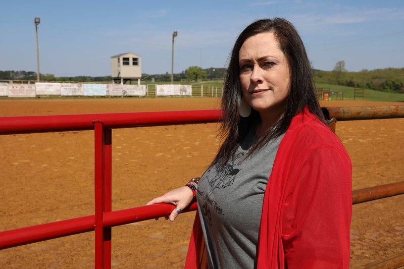 Danielle Smith stands just outside Smith Arena in Rose Bud, where she watched as her 14-year-old son, Brander Smith, was killed in an accident last summer while practicing for a national roping competition. Danielle first considered selling it before embracing the arena as holy ground and starting the nonprofit Brander’d by Christ in his memory.
(Special to the Democrat-Gazette/Dwain Hebda)