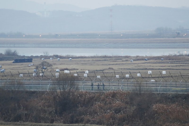 South Korean army soldiers patrol along the barbed-wire fence in Paju, South Korea, near the border with North Korea in this Dec. 16, 2019, file photo.