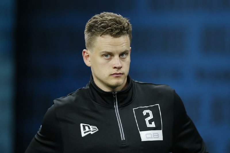 LSU quarterback Joe Burrow watches a drill at the NFL football scouting combine in Indianapolis, Thursday, Feb. 27, 2020. (AP Photo/Charlie Neibergall)