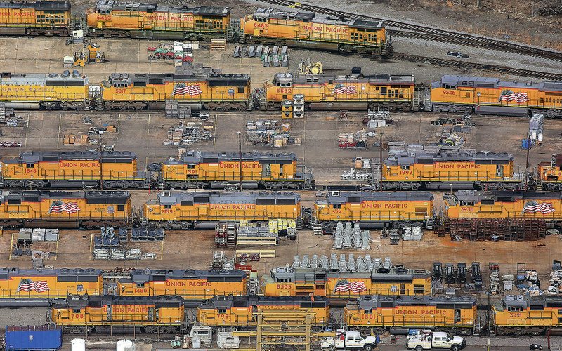 Union Pacific diesel locomotives are lined up in 2018 in different stages of repair at Union Pacific Railroad's Jenks Shop heavy locomotive repair facility in North Little Rock. The railroad announced Thursday it's temporarily closing the facility and furloughing most of its staff. (File Photo/Arkansas Democrat-Gazette/Benjamin Krain)