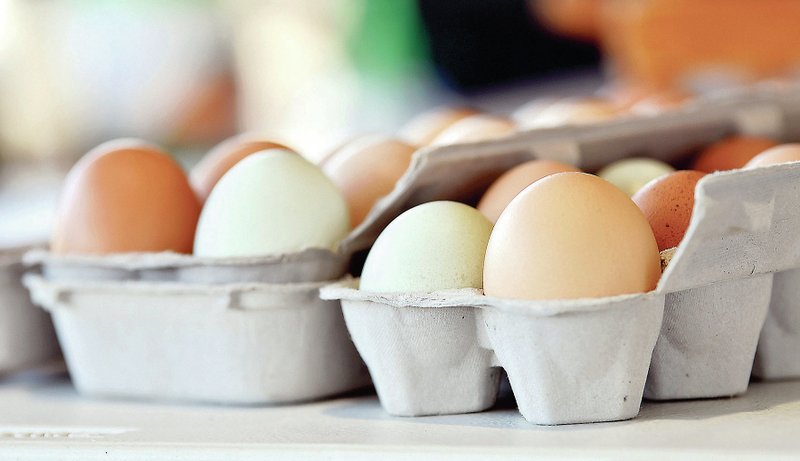 Cartons of eggs for sale sit on a table on at the Columbia Farmers Market in Columbia, Mo. Since the covid-19 outbreak, egg sales have increased. (Columbia Missourian/Elizabeth Underwood) 