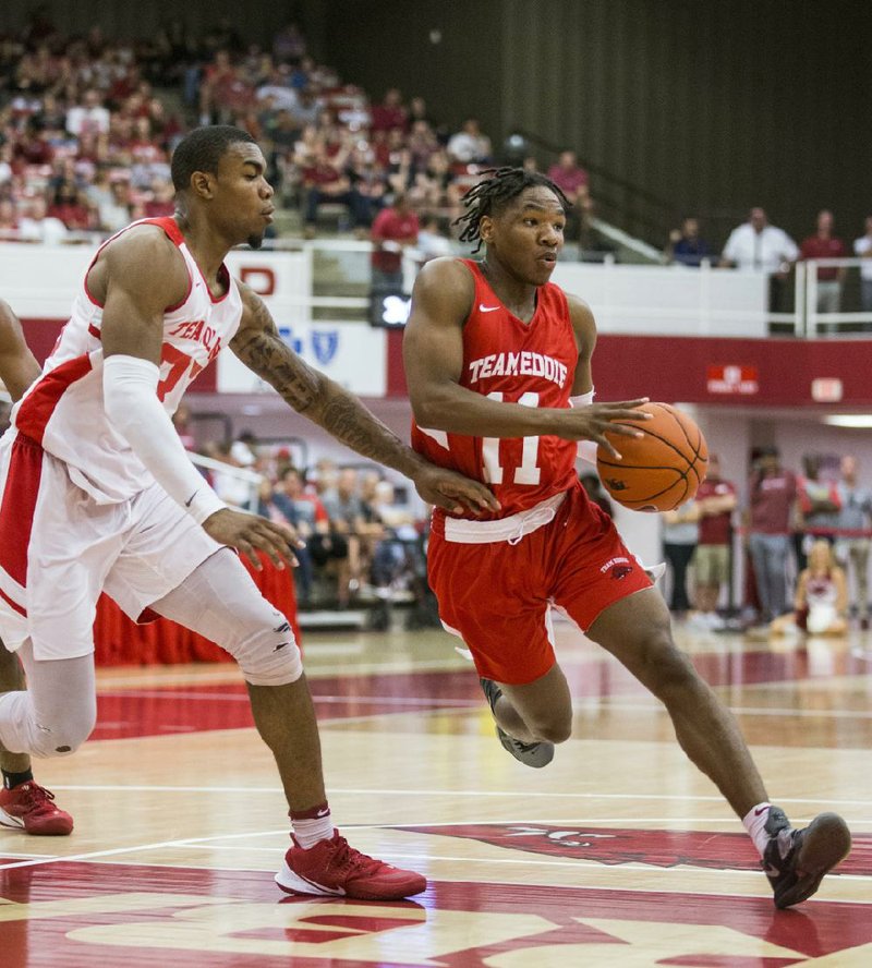 Arkansas guard JD Notae (right) is making the most of his time while back home in Covington, Ga. Notae has a day-by-day training and workout plan to try to improve his game. (NWA Democrat-Gazette/Ben Goff) 