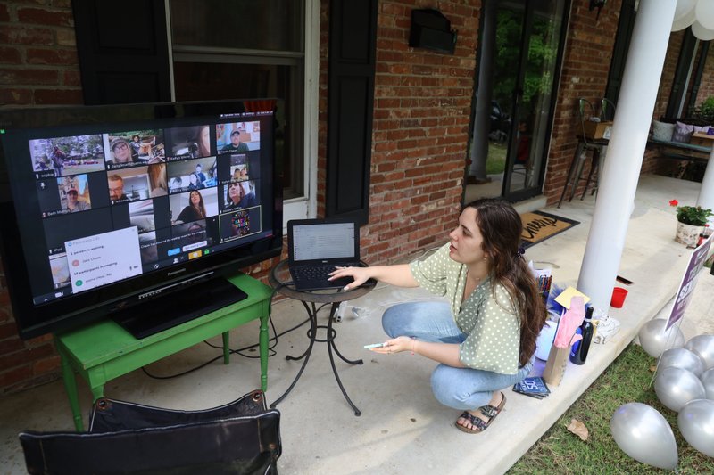 Sophie Mammarelli connects well-wishers via Zoom for her mother's birthday party, one way the family has tried to achieve some normalcy in the age of coronavirus.
(Special to the Democrat-Gazette/Dwain Hebda) story.lead_photo.caption