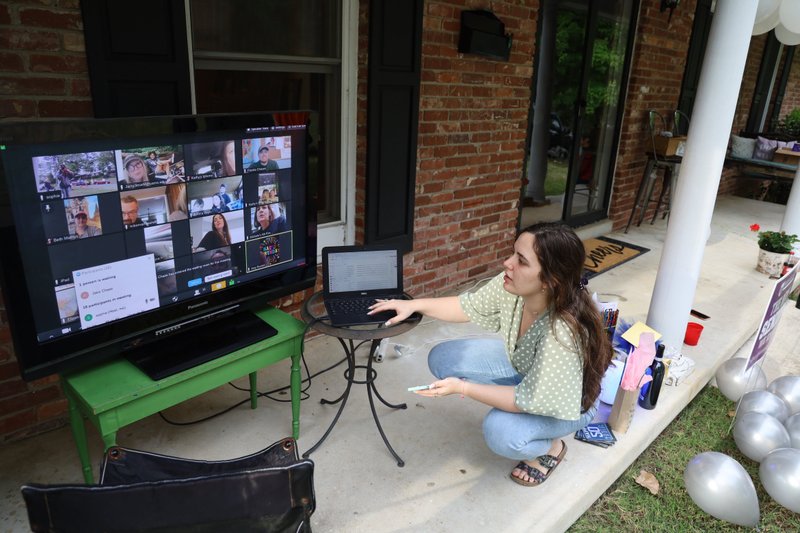 Sophie Mammarelli connects well-wishers via Zoom for her mother's birthday party, one way the family has tried to achieve some normalcy in the age of coronavirus.

(Special to the Democrat-Gazette/Dwain Hebda)