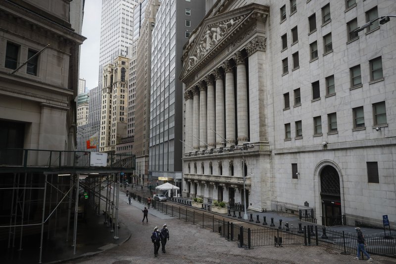 FILE - In a Friday, May 1, 2020 file photo, NYPD officers walk along a sparsely populated Wall Street, in the Manhattan borough of New York. The devastation rocking the economy becomes more clear by the week with reports continually showing how many million workers have lost their jobs due to the coronavirus outbreak. Wall Street sees that pain, but it already sent the U.S. stock market down by a third more than a month ago on anticipation of that. Now, it&#x2019;s looking further ahead and sees a future that&#x2019;s not as bad as this horrific present. That&#x2019;s why stocks just had their best month in a generation. Whether they&#x2019;re correct is still to be determined. (AP Photo/John Minchillo, File)