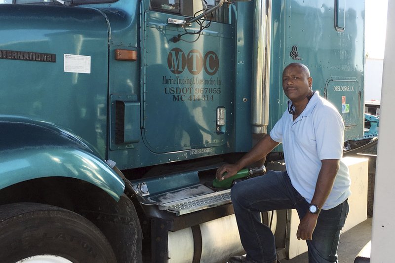 This April 29, 2020 photo provided by Rodney Morine, shows Morine preparing to make a delivery in Opelousas, La. Morine believes his second chance is no better than his first to secure a loan through a government program intended to help small businesses like his survive the pandemic. &#x201c;I have zero confidence,&#x201d; said Morine, an independent truck driver in Opelousas, Louisiana, whose revenues have dropped by half since the coronavirus outbreak hit the U.S. (Amani Simmons via AP)