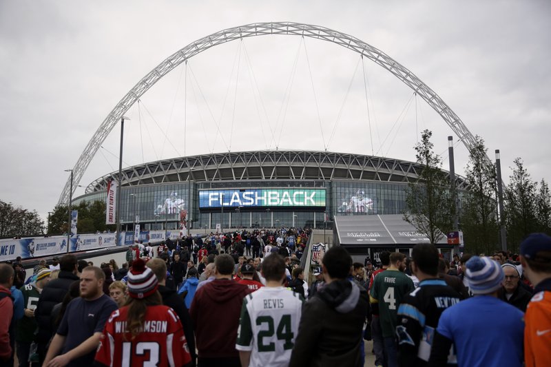 FILE - In this Oct. 26, 2014, file photo, sans arrive at Wembley Stadium before an NFL football game between the Atlanta Falcons and the Detroit Lions in London. The NFL is moving its five games scheduled for London and Mexico City this season back to U.S. stadiums because of the coronavirus pandemic. All five regular-season games will now be played at the stadiums of the host teams. (AP Photo/Matt Dunham, File)