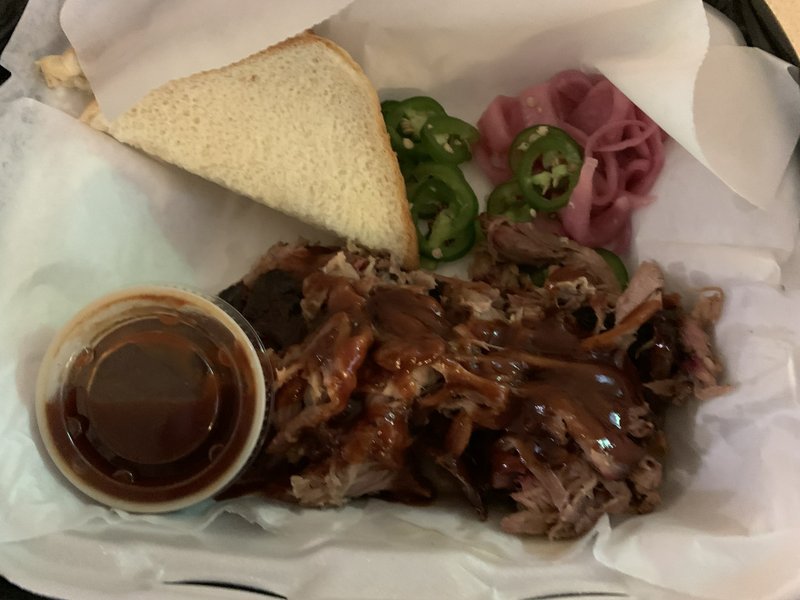 Count Porkula's pulled pork plate comes with bread, fresh jalapenos and pickled onions. Not shown: side dishes of mustard-based potato salad and the restaurant's dill pickle pasta salad.

(Arkansas Democrat-Gazette/Eric E. Harrison)