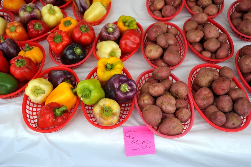 Vegetables are offered for sale at the Rogers Farmers Market in this 2015 file photo.