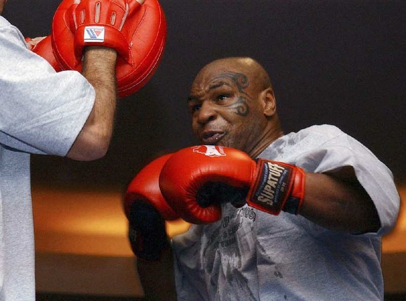 Former heavyweight boxing champion Mike Tyson, shown during a 2006 sparring session, hasn’t announced any plans to return to the ring, though he did suggest on an Instagram post he might make himself available for three- or fourround exhibitions if the price was right.
(AP file photo)