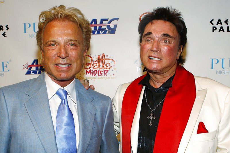 Siegfried Fischbacher (left) and Roy Horn arrive at a party at Caesar's Palace hotel and casino in Las Vegas in this Feb. 20, 2008, file photo. Horn, one half of the longtime Las Vegas illusionist duo Siegfried & Roy, has died of complications from covid-19, according to a spokesman. He was 75.