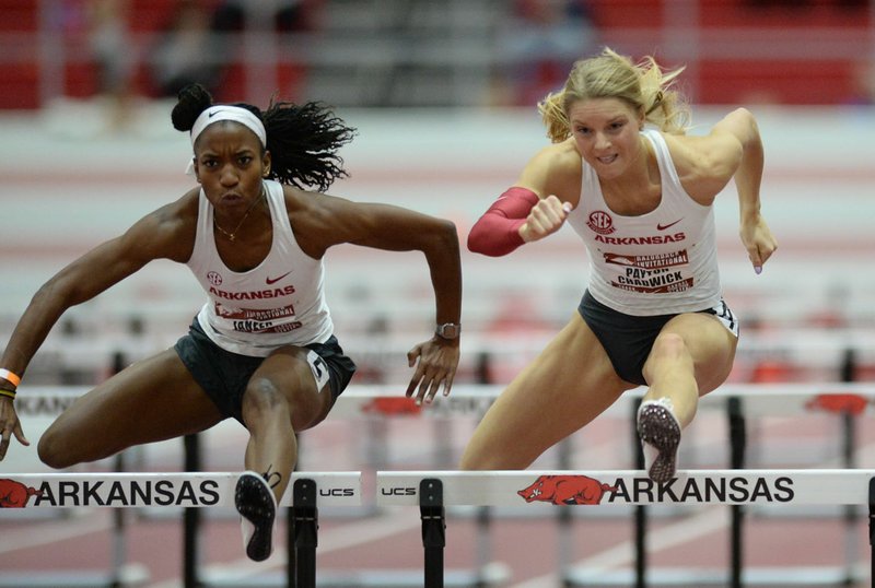 Former Arkansas standout Payton Chadwick (right), whose outdoor season ended two weeks before it even started because of the coronavirus pandemic, spends her days training in Paris, Texas, home of her husband Connor. 
(NWA Democrat-Gazette/Andy Shupe) 