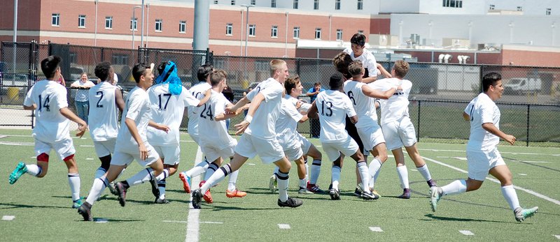 Graham Thomas/Siloam Sunday Siloam Springs players celebrate after Jose Serrano scored the winning goal in the kicks from the spot period of Class 6A state semifinal on May 12, 2017. Siloam Springs defeated Little Rock Hall to advance to state championship game against Mountain Home, which Siloam Springs defeated 4-0 for the state title.